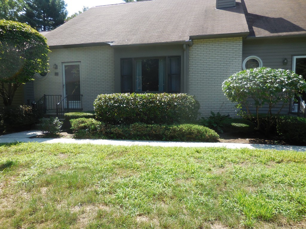 419 Southwick Road, Unit P64 Westfield, MA 01085 - Photo 2 of 14 a view of a house with a garden