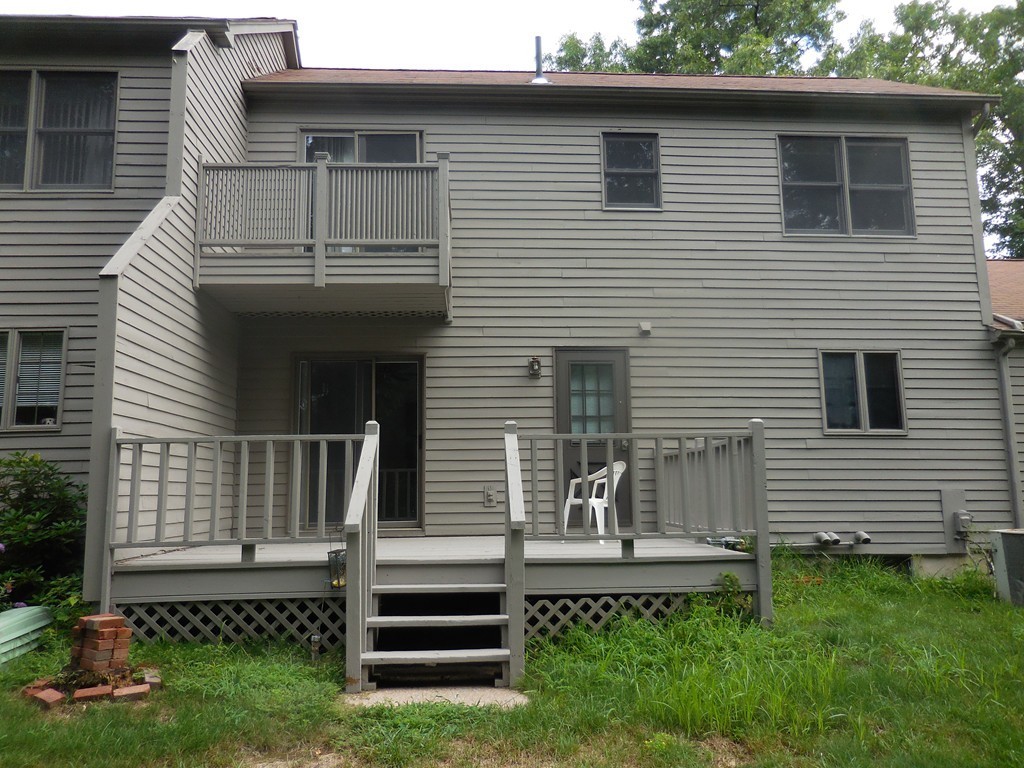 419 Southwick Road, Unit P64 Westfield, MA 01085 - Photo 3 of 14 a view of a house with a yard