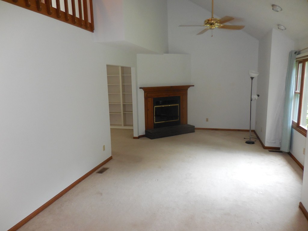 419 Southwick Road, Unit P64 Westfield, MA 01085 - Photo 5 of 14 an empty room with a fireplace