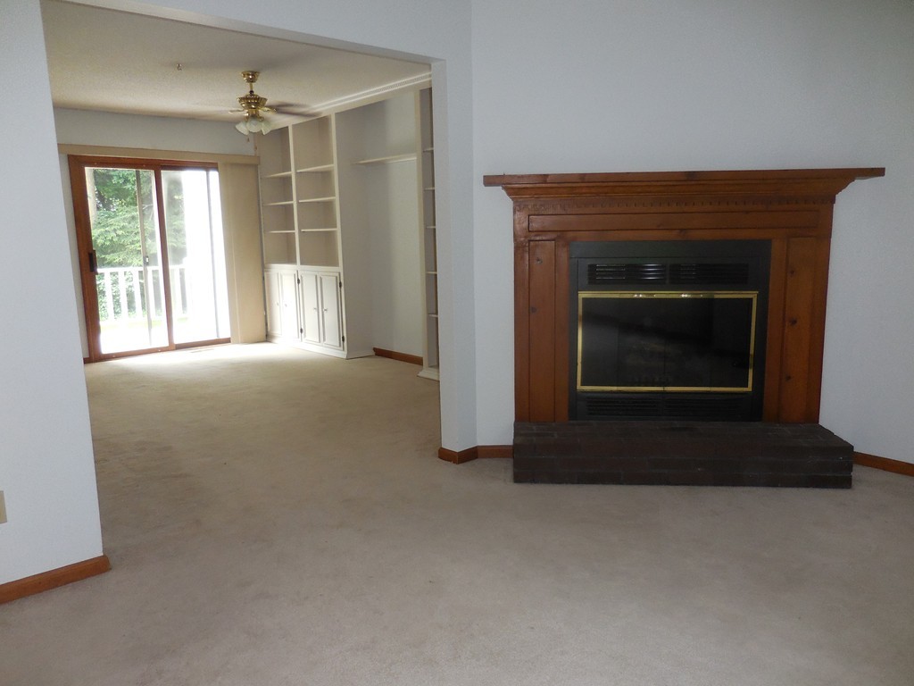 419 Southwick Road, Unit P64 Westfield, MA 01085 - Photo 6 of 14 a living room with a fireplace