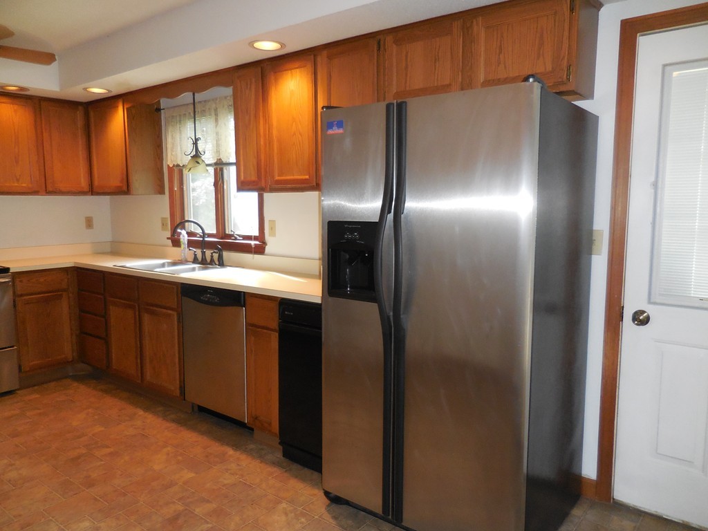 419 Southwick Road, Unit P64 Westfield, MA 01085 - Photo 7 of 14 a kitchen with stainless steel appliances granite countertop a refrigerator and a sink