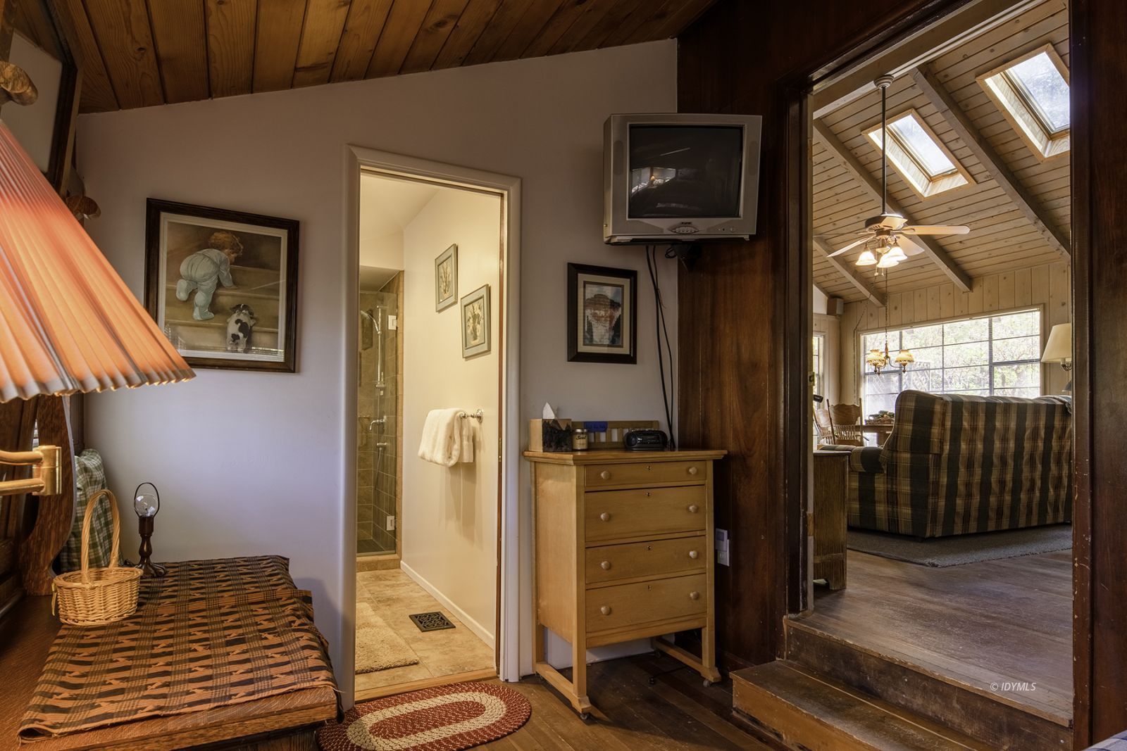25180 Glen Road Idyllwild, CA 92549 - Photo 12 of 45 a view of a hallway with wooden floor and staircase