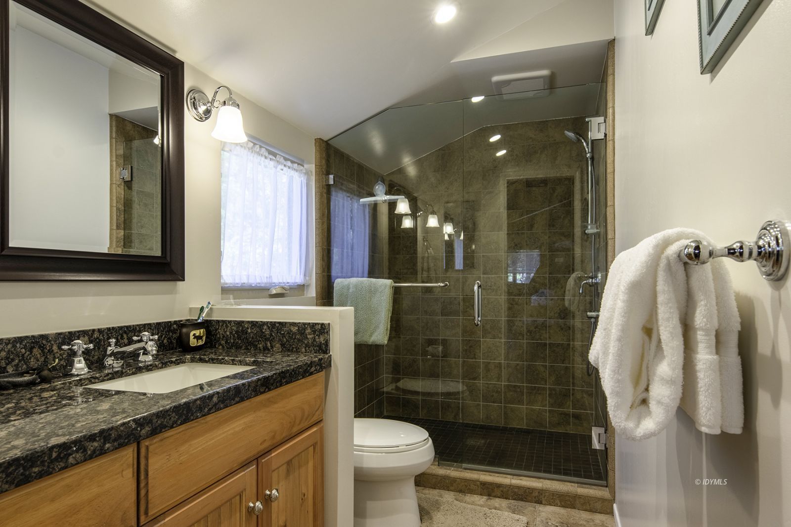 25180 Glen Road Idyllwild, CA 92549 - Photo 13 of 45 a bathroom with a granite countertop sink toilet and shower