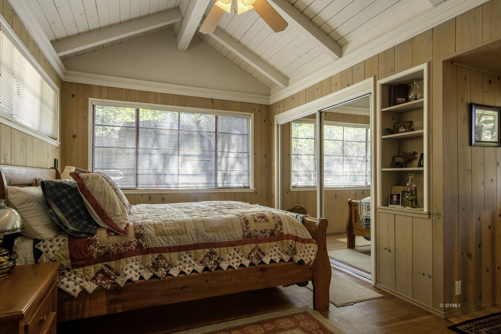 25180 Glen Road Idyllwild, CA 92549 - Photo 15 of 45 a bedroom with a bed and wooden floor