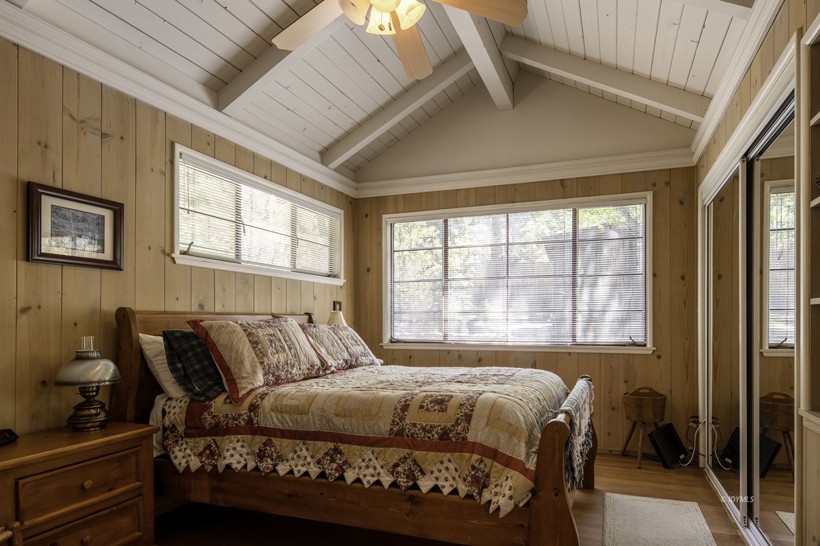 25180 Glen Road Idyllwild, CA 92549 - Photo 16 of 45 a bedroom with a bed and wooden floor