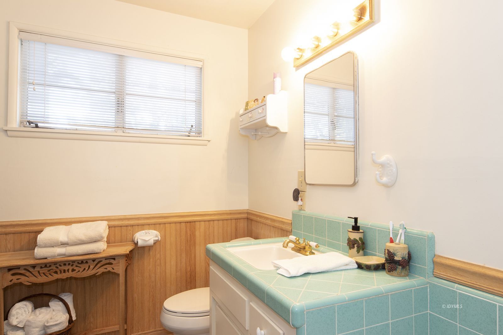 25180 Glen Road Idyllwild, CA 92549 - Photo 22 of 45 a bathroom with a granite countertop sink vanity mirror and toilet