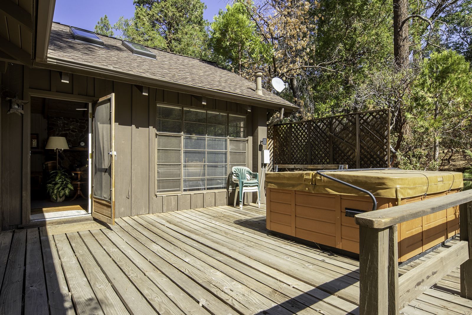 25180 Glen Road Idyllwild, CA 92549 - Photo 39 of 45 a view of a patio with table and chairs with wooden floor and fence