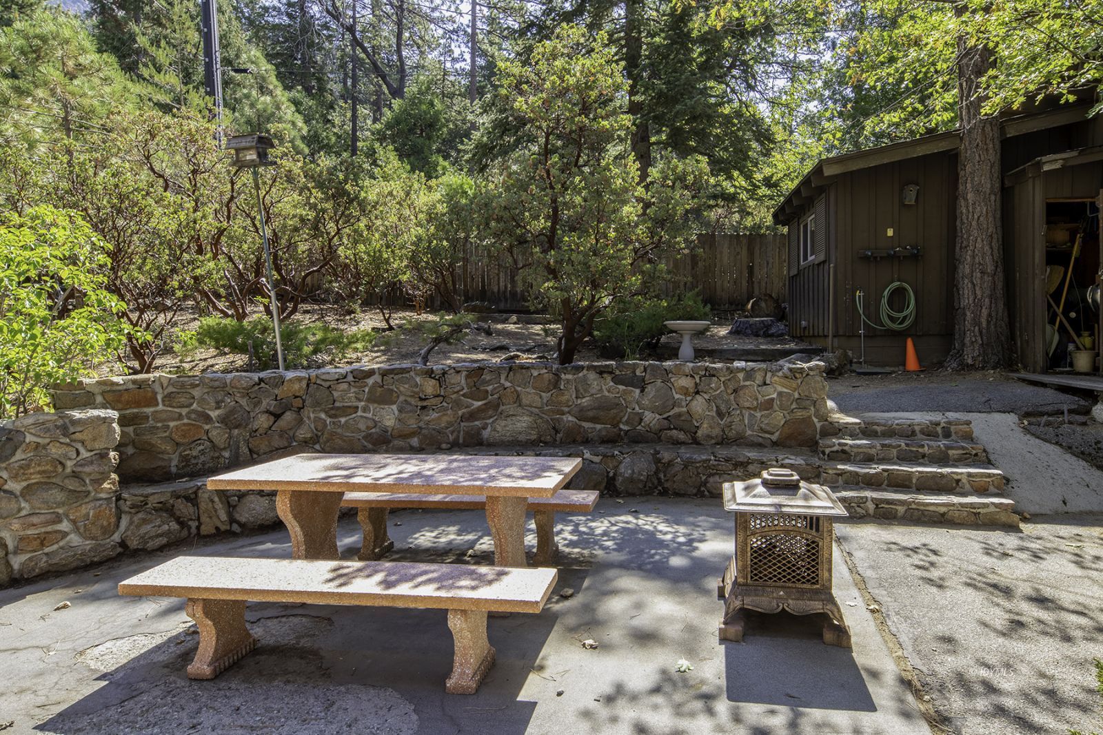 25180 Glen Road Idyllwild, CA 92549 - Photo 40 of 45 a view of a patio with table and chairs and potted plants