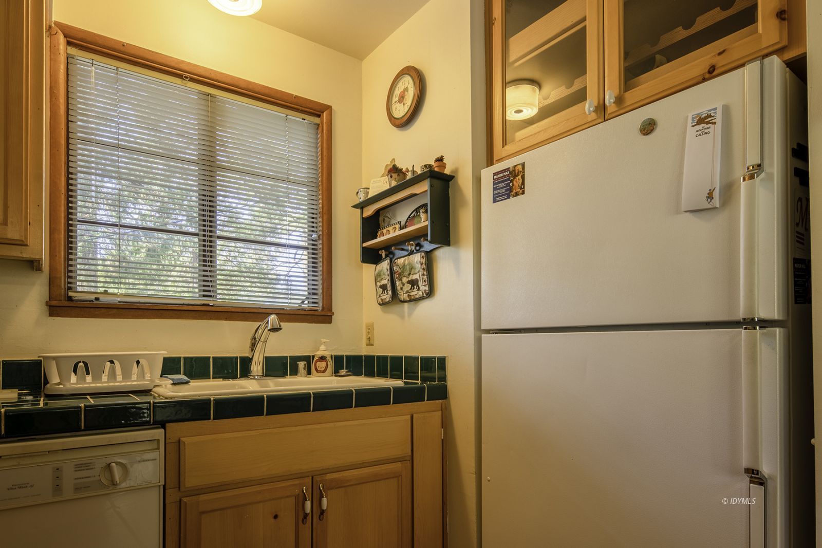 25180 Glen Road Idyllwild, CA 92549 - Photo 10 of 45 a white refrigerator freezer sitting inside of a kitchen