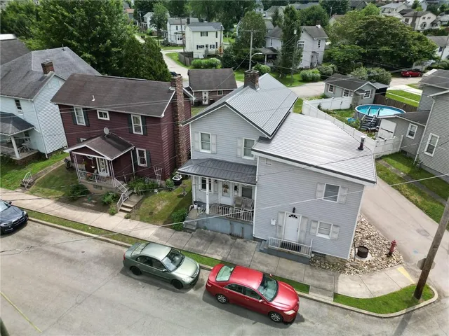 an aerial view of multiple houses with outdoor space