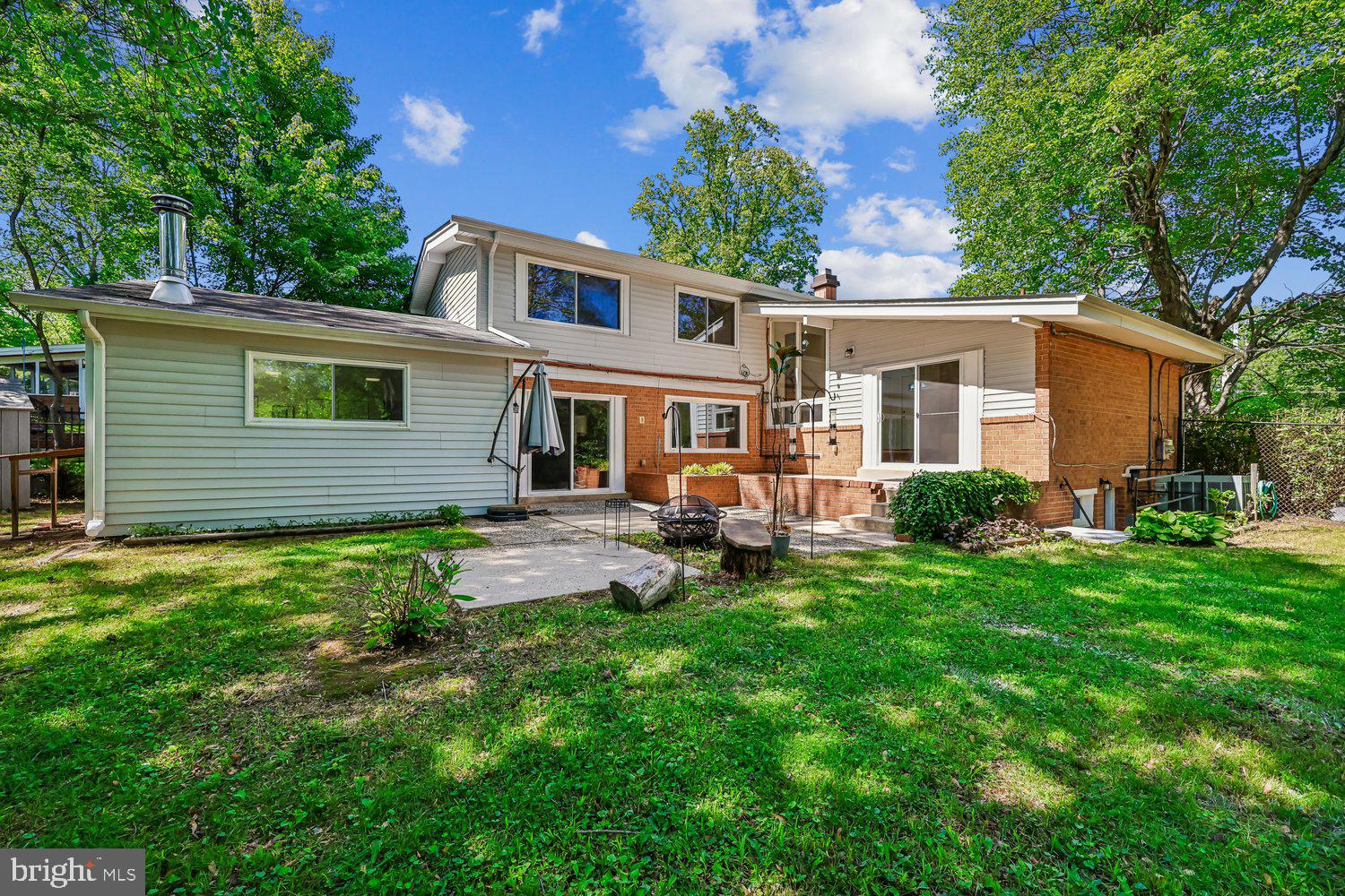 300 Gilsan Court Silver Spring, MD 20902 - Photo 17 of 117 a view of a house with a backyard and sitting area