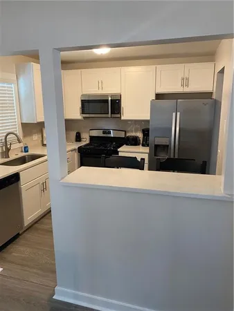 a view of a workspace and a living room