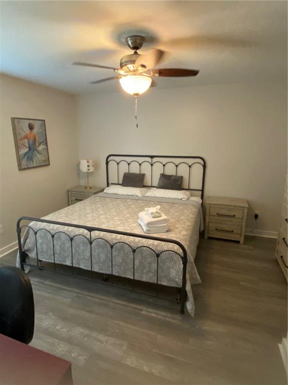 1608 Willie Drive Marietta, GA 30062 - Photo 22 of 35 a bedroom with a bed and a chandelier