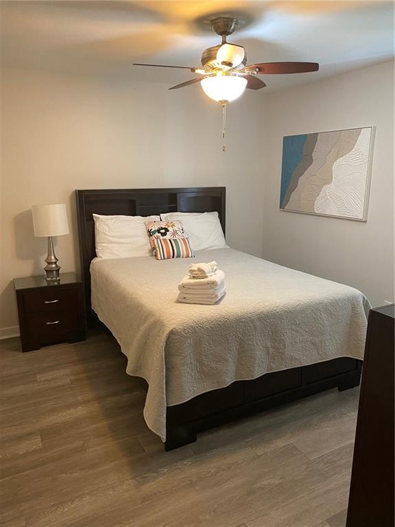 1608 Willie Drive Marietta, GA 30062 - Photo 27 of 35 a bedroom with a bed and a chandelier