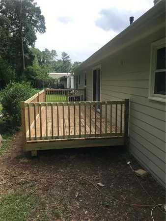 a view of balcony with furniture