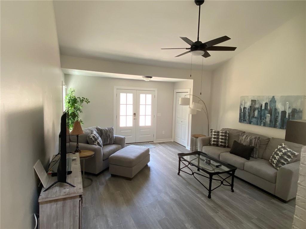 1608 Willie Drive Marietta, GA 30062 - Photo 3 of 35 a living room with furniture and a wooden floor