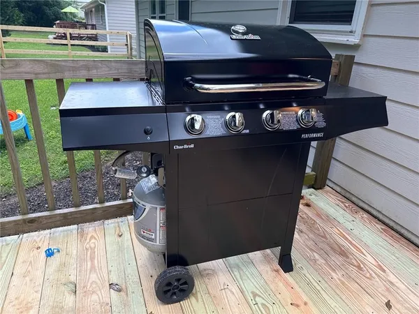 a view of a backyard with large trees