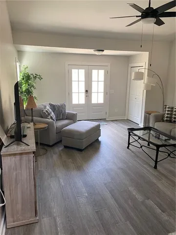 a living room with furniture and a window