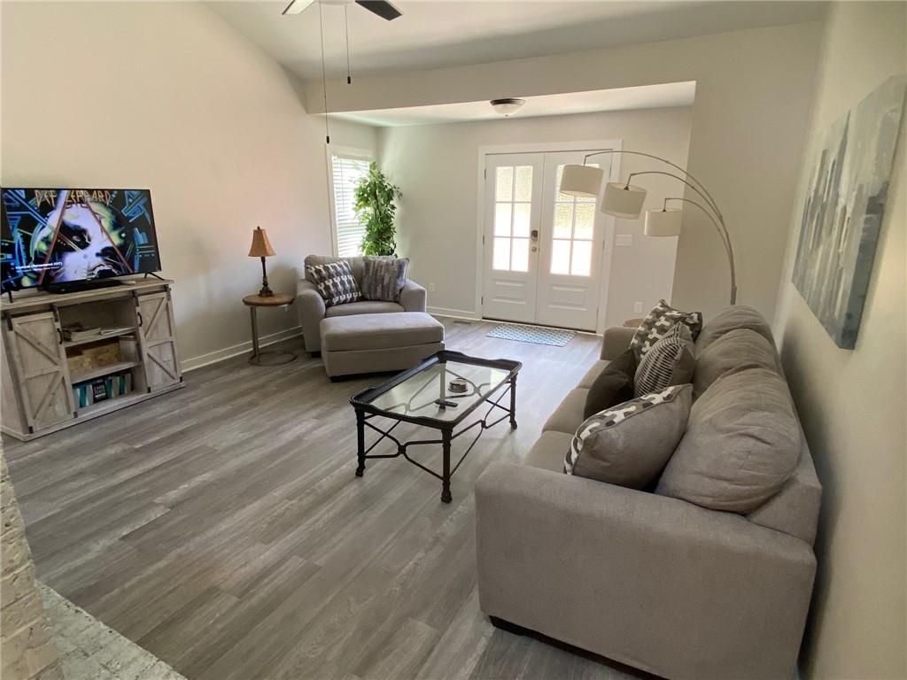 1608 Willie Drive Marietta, GA 30062 - Photo 5 of 35 a living room with furniture and a wooden floor