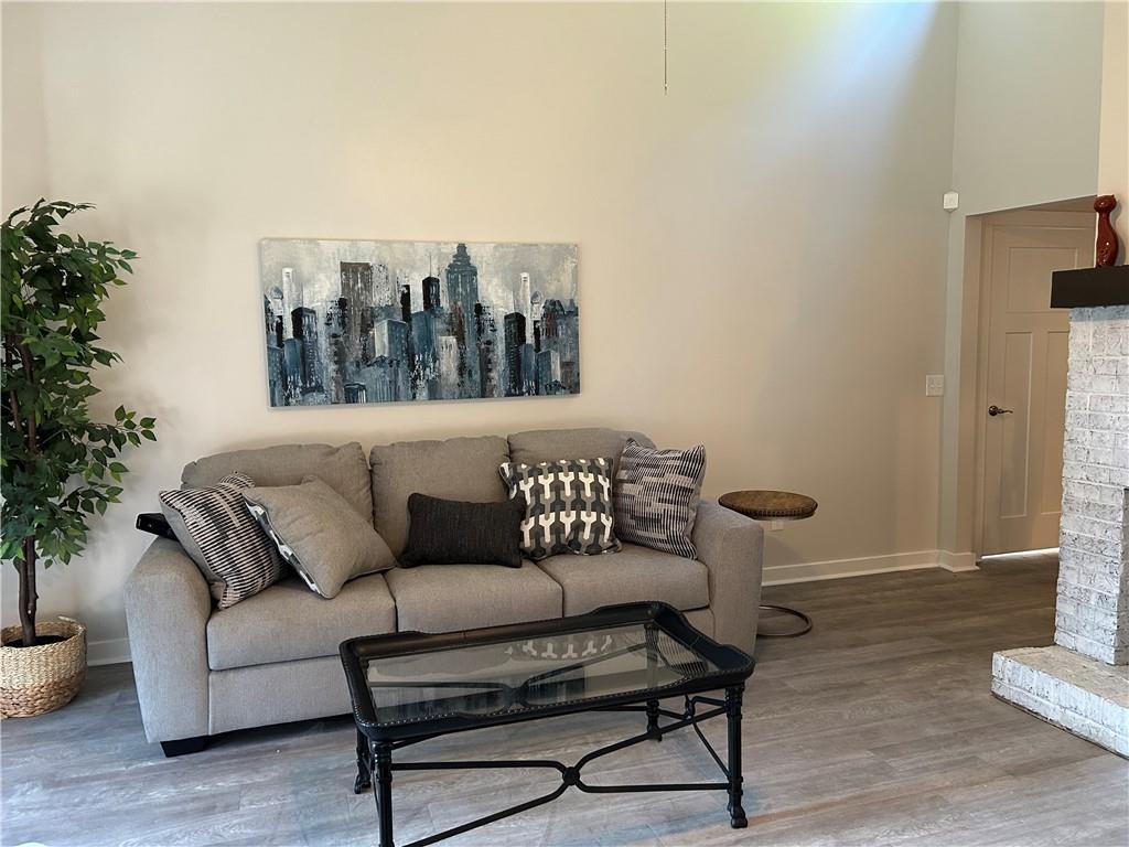 1608 Willie Drive Marietta, GA 30062 - Photo 7 of 35 a living room with furniture and a potted plant