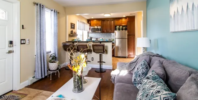 a view of kitchen with furniture and refrigerator
