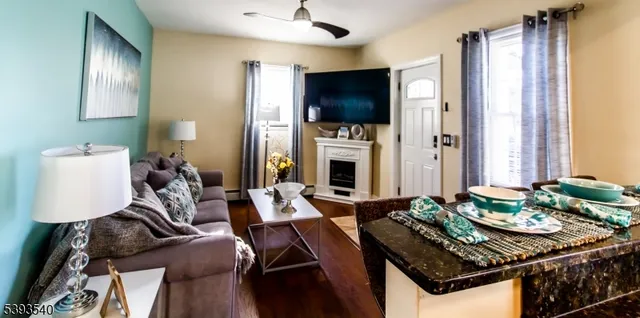 a living room with furniture and a flat screen tv