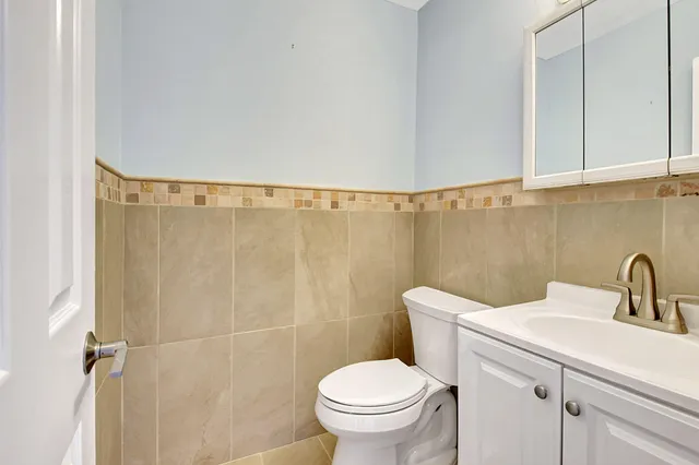 a spacious bedroom with a bed and large window