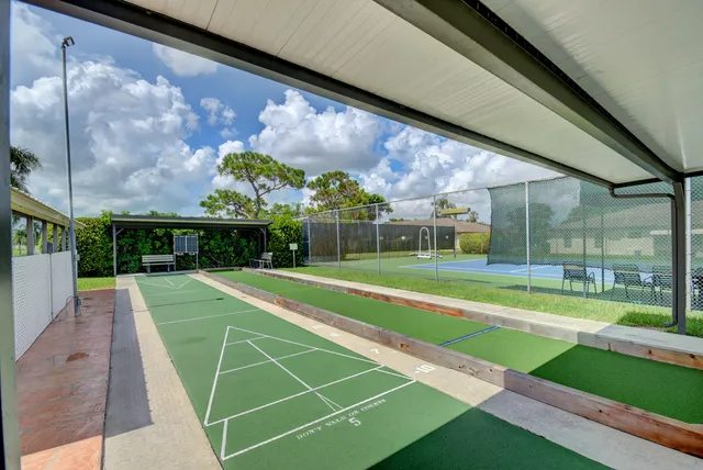 a view of a swimming pool and a yard