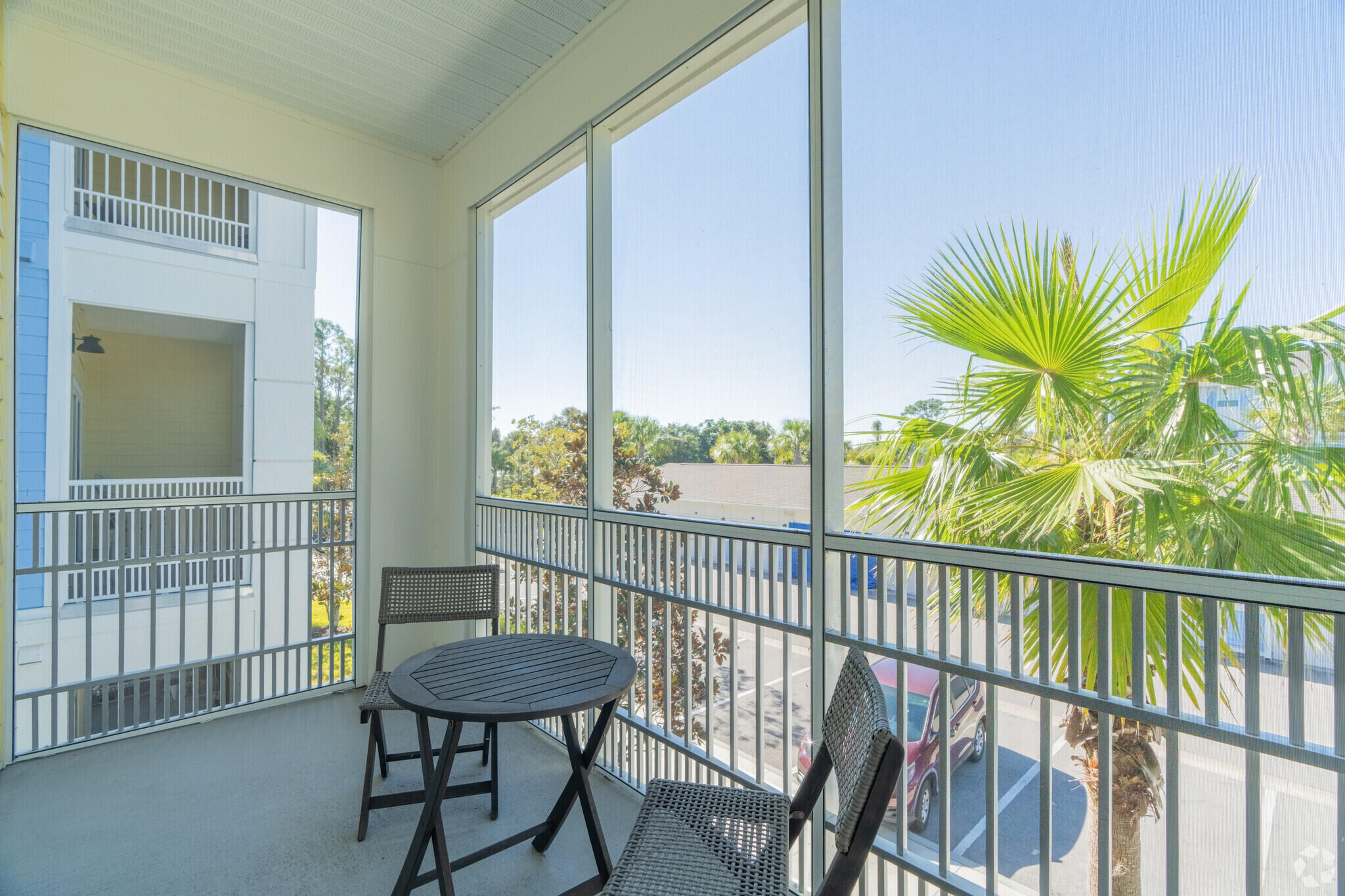 1924 Northwest Federal Highway, Unit 2101 Stuart, FL 34994 - Photo 11 of 16 a view of a porch with a table and chairs