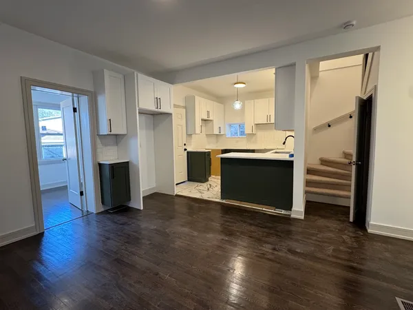a view of kitchen and wooden floor