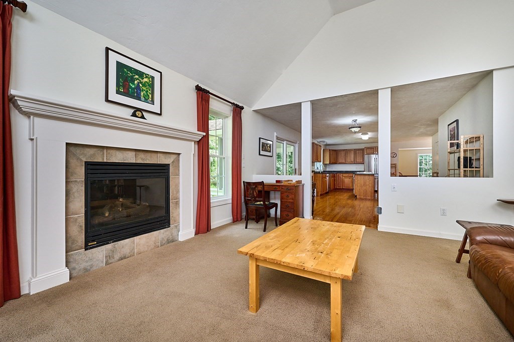 37 Shattuck Road Hadley, MA 01035 - Photo 17 of 42 a living room with furniture and a fireplace