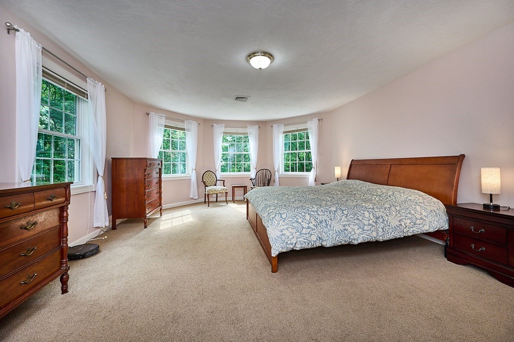 37 Shattuck Road Hadley, MA 01035 - Photo 20 of 42 a bedroom with a bed and window