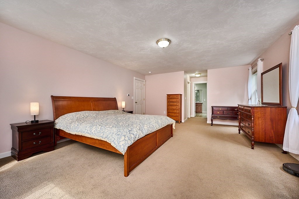 37 Shattuck Road Hadley, MA 01035 - Photo 21 of 42 a bedroom with a bed and wooden floor