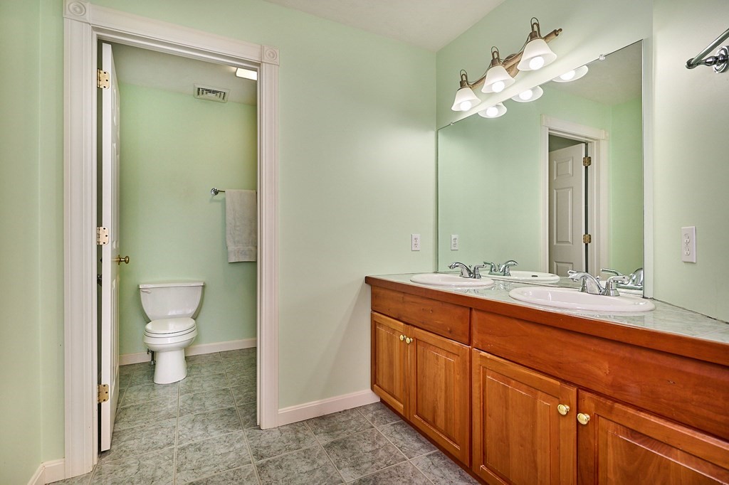 37 Shattuck Road Hadley, MA 01035 - Photo 30 of 42 a bathroom with a double vanity sink and a toilet