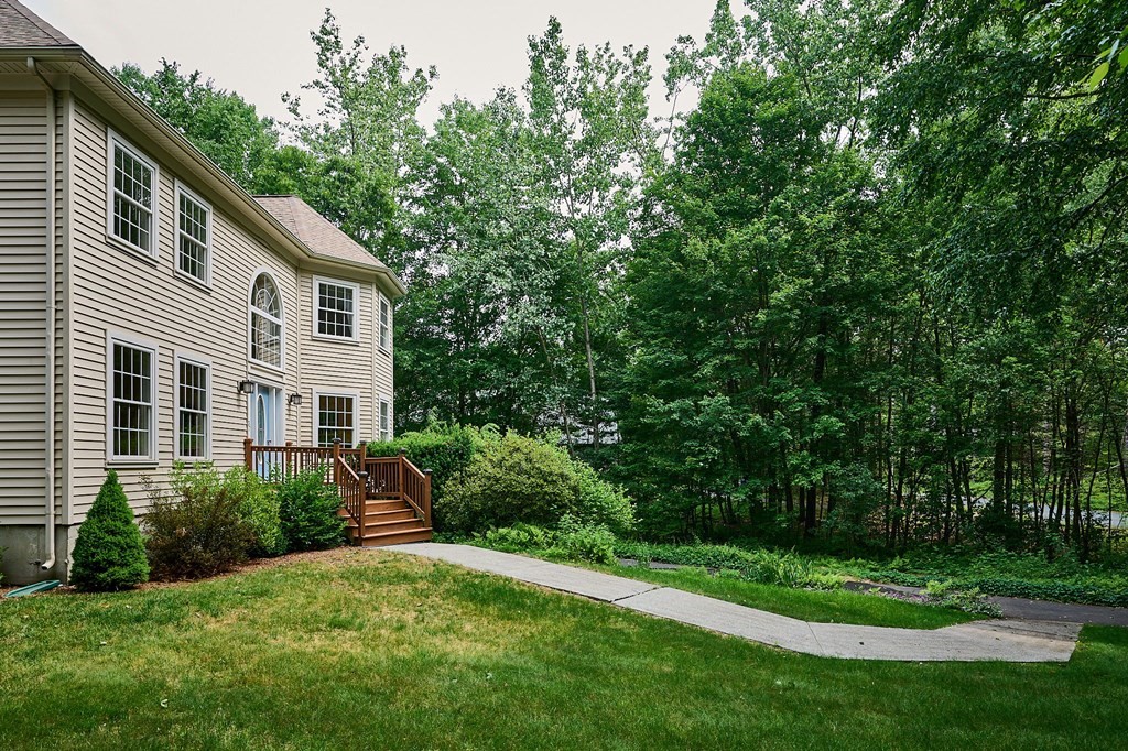 37 Shattuck Road Hadley, MA 01035 - Photo 32 of 42 a front view of a house with a yard and trees