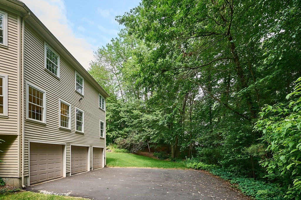 37 Shattuck Road Hadley, MA 01035 - Photo 34 of 42 a front view of a house with a yard and garage