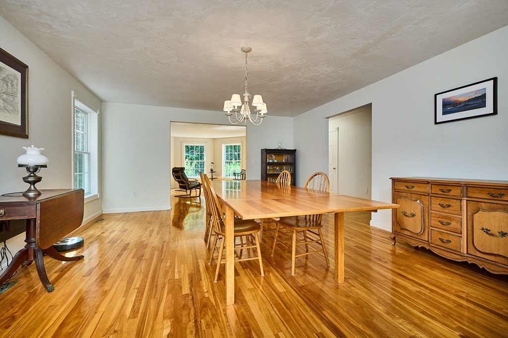 37 Shattuck Road Hadley, MA 01035 - Photo 6 of 42 a living room with furniture a dining table and wooden floor