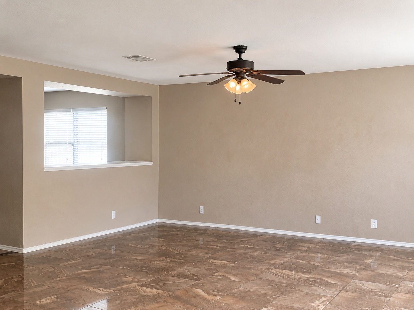 122 Rummel Drive Kyle, TX 78640 - Photo 5 of 18 A living space offers generous dimensions and durable, polished tile flooring.