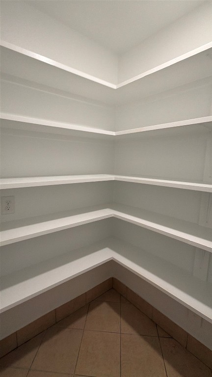 301 South Mustang Avenue Cedar Park, TX 78613 - Photo 8 of 20 a refrigerator sitting in a bathroom with a bathtub