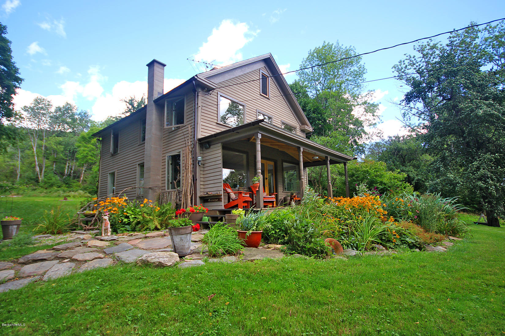 47 Main Road Tyringham, MA 01238 - Photo 1 of 31 a view of a house with garden and yard