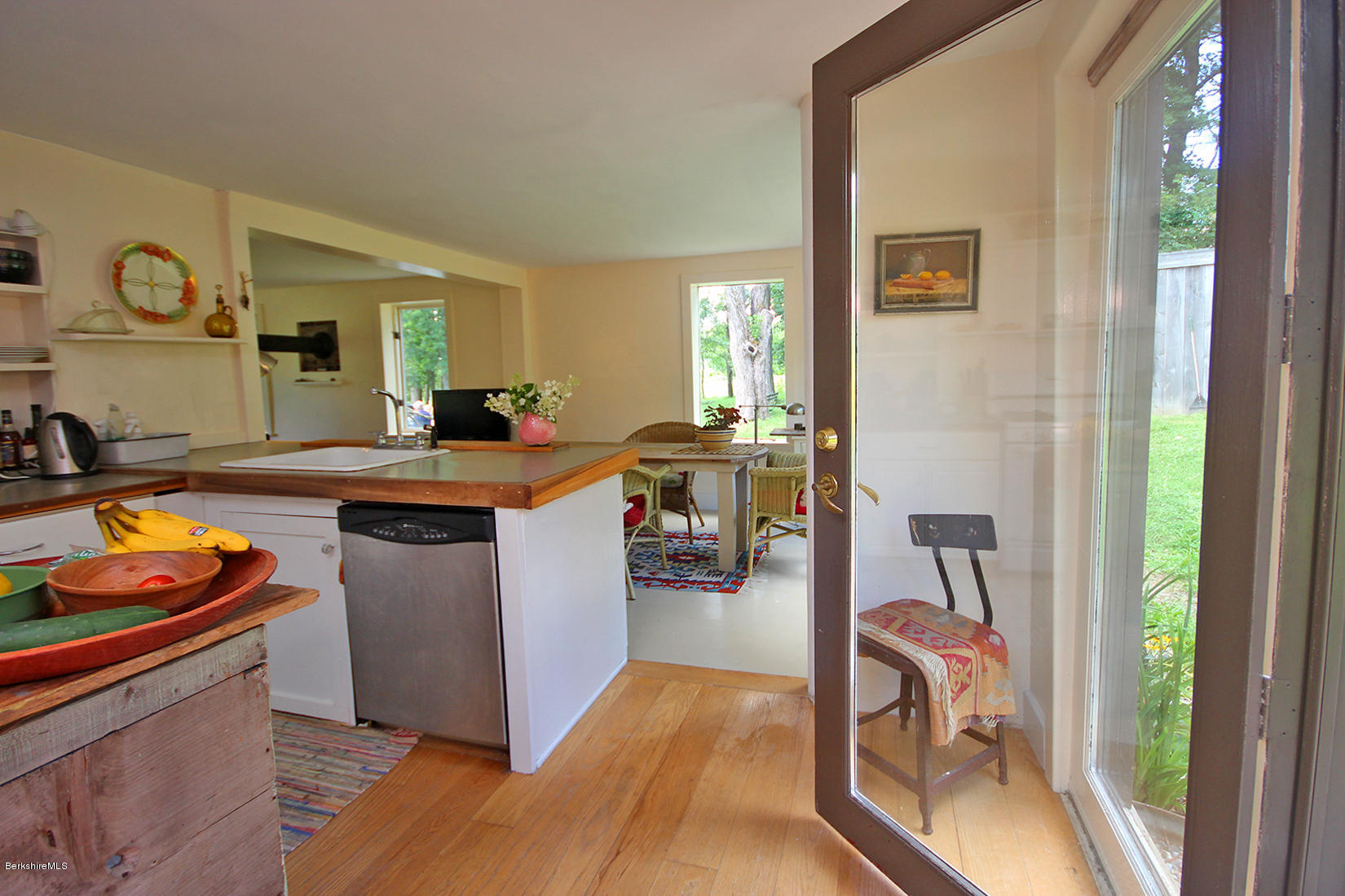 47 Main Road Tyringham, MA 01238 - Photo 12 of 31 a kitchen with granite countertop a sink and a stove top open
