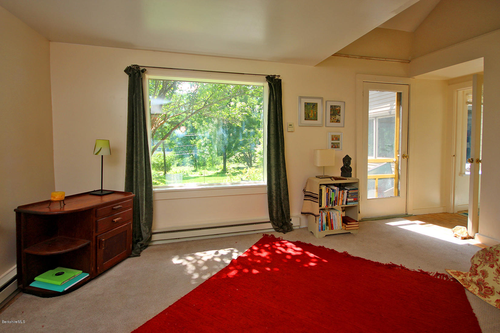 47 Main Road Tyringham, MA 01238 - Photo 16 of 31 a bedroom with a bed and a window