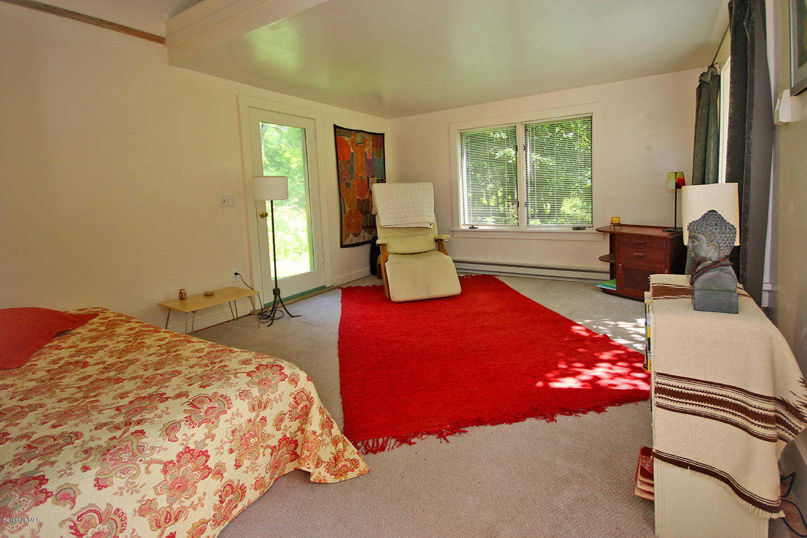 47 Main Road Tyringham, MA 01238 - Photo 17 of 31 a bedroom with a bed and window