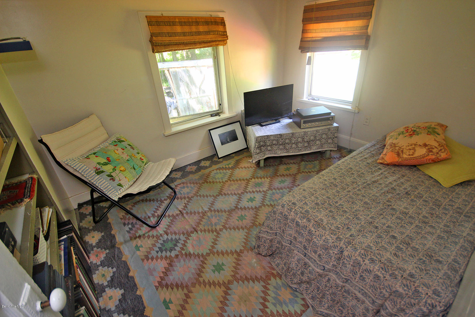 47 Main Road Tyringham, MA 01238 - Photo 21 of 31 a living room with furniture and a window