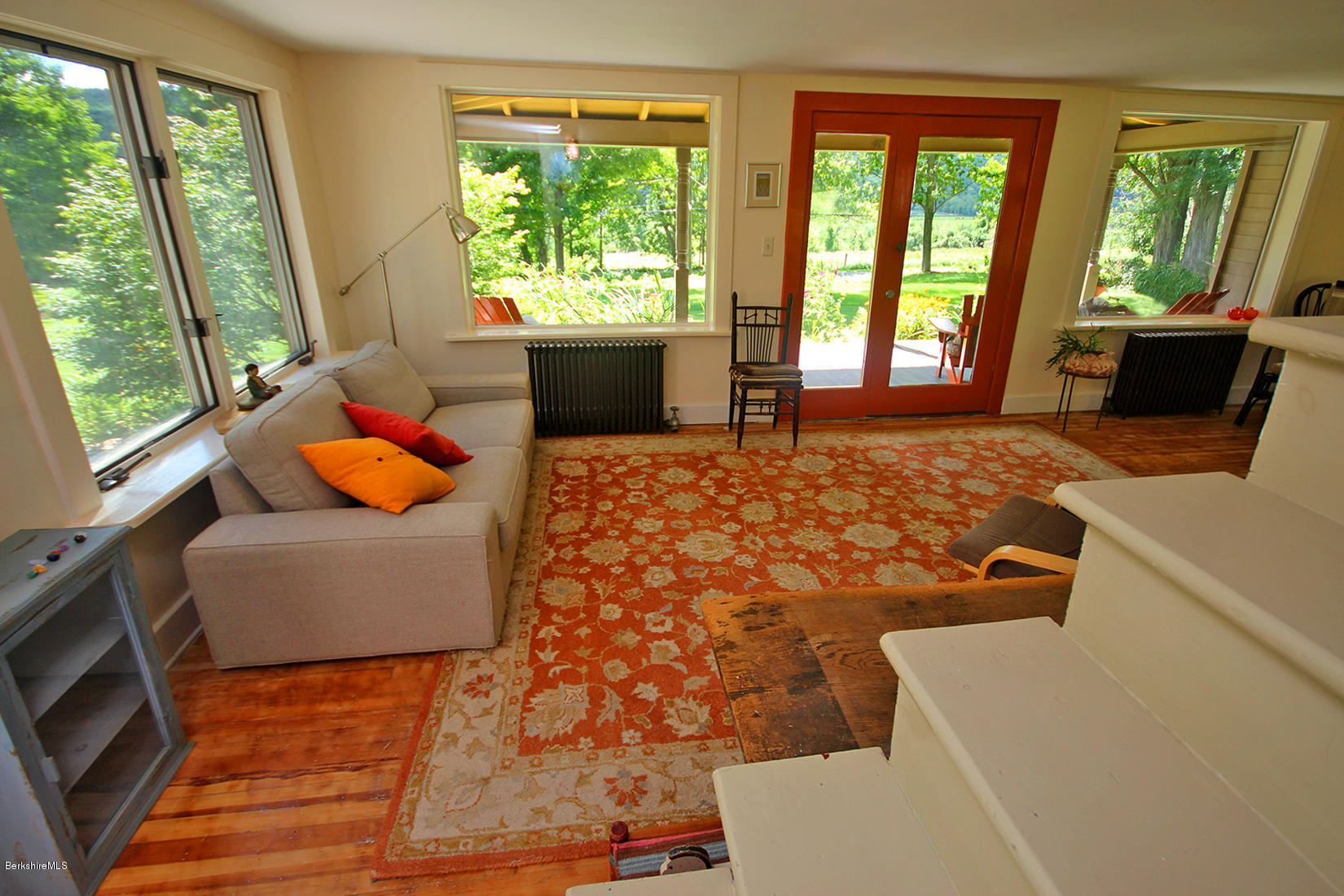 47 Main Road Tyringham, MA 01238 - Photo 24 of 31 a living room with furniture and a flat screen tv