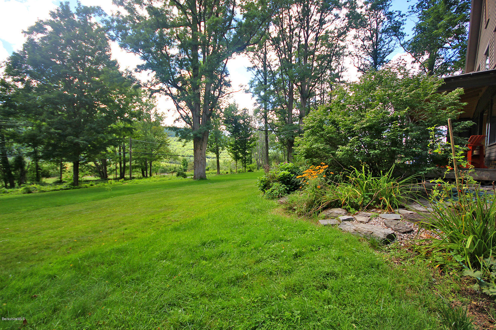 47 Main Road Tyringham, MA 01238 - Photo 27 of 31 a view of green field with trees