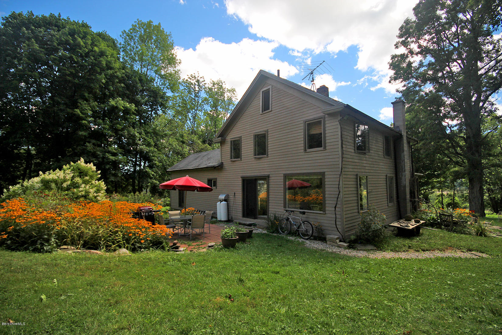 47 Main Road Tyringham, MA 01238 - Photo 28 of 31 a view of a house with backyard