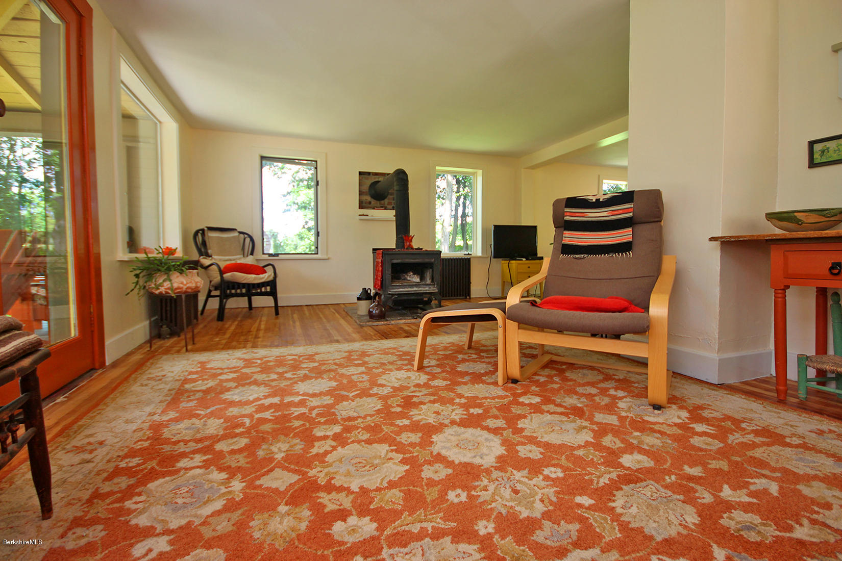 47 Main Road Tyringham, MA 01238 - Photo 6 of 31 a living room with furniture a rug and a window