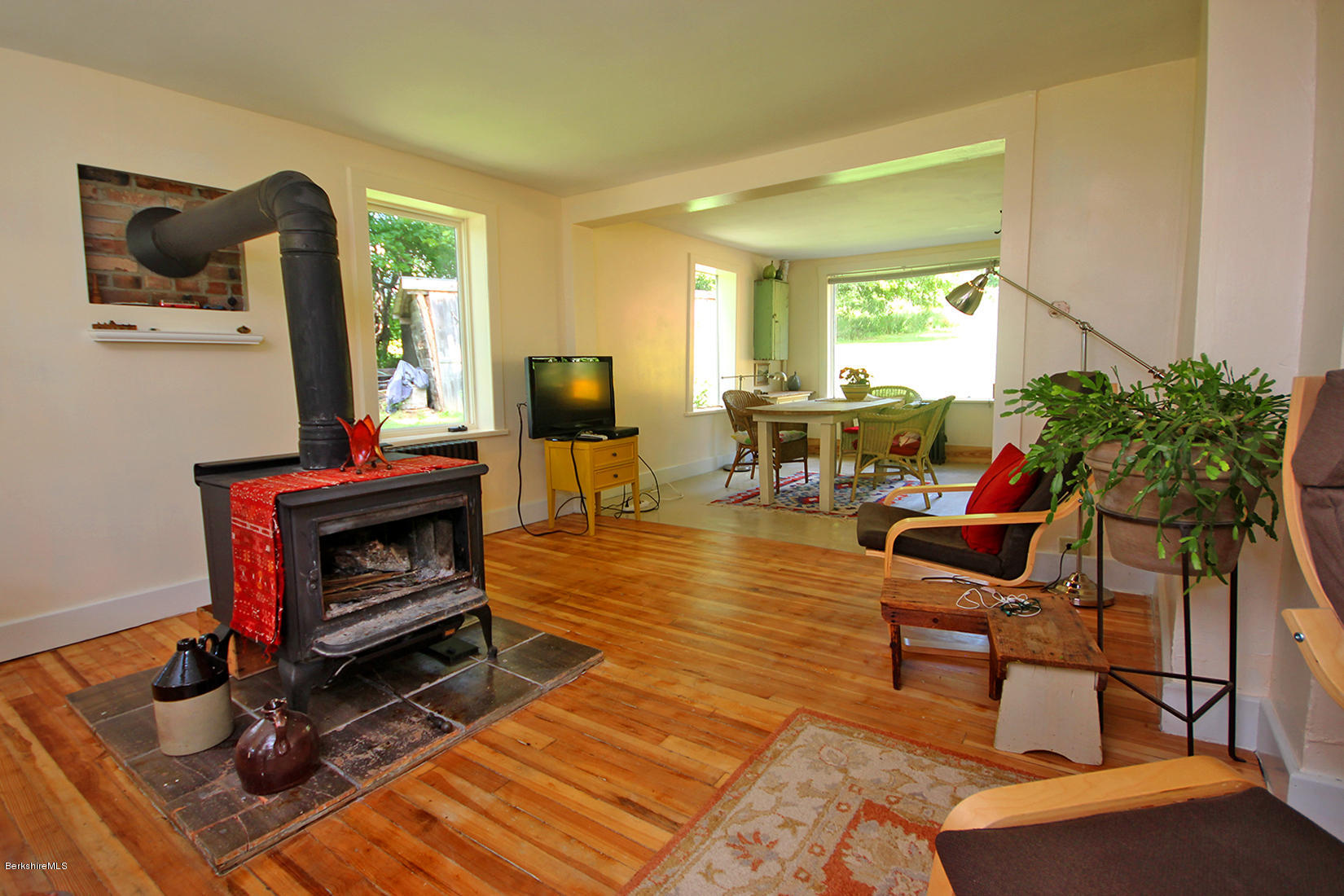 47 Main Road Tyringham, MA 01238 - Photo 7 of 31 a living room with furniture a window and a fireplace