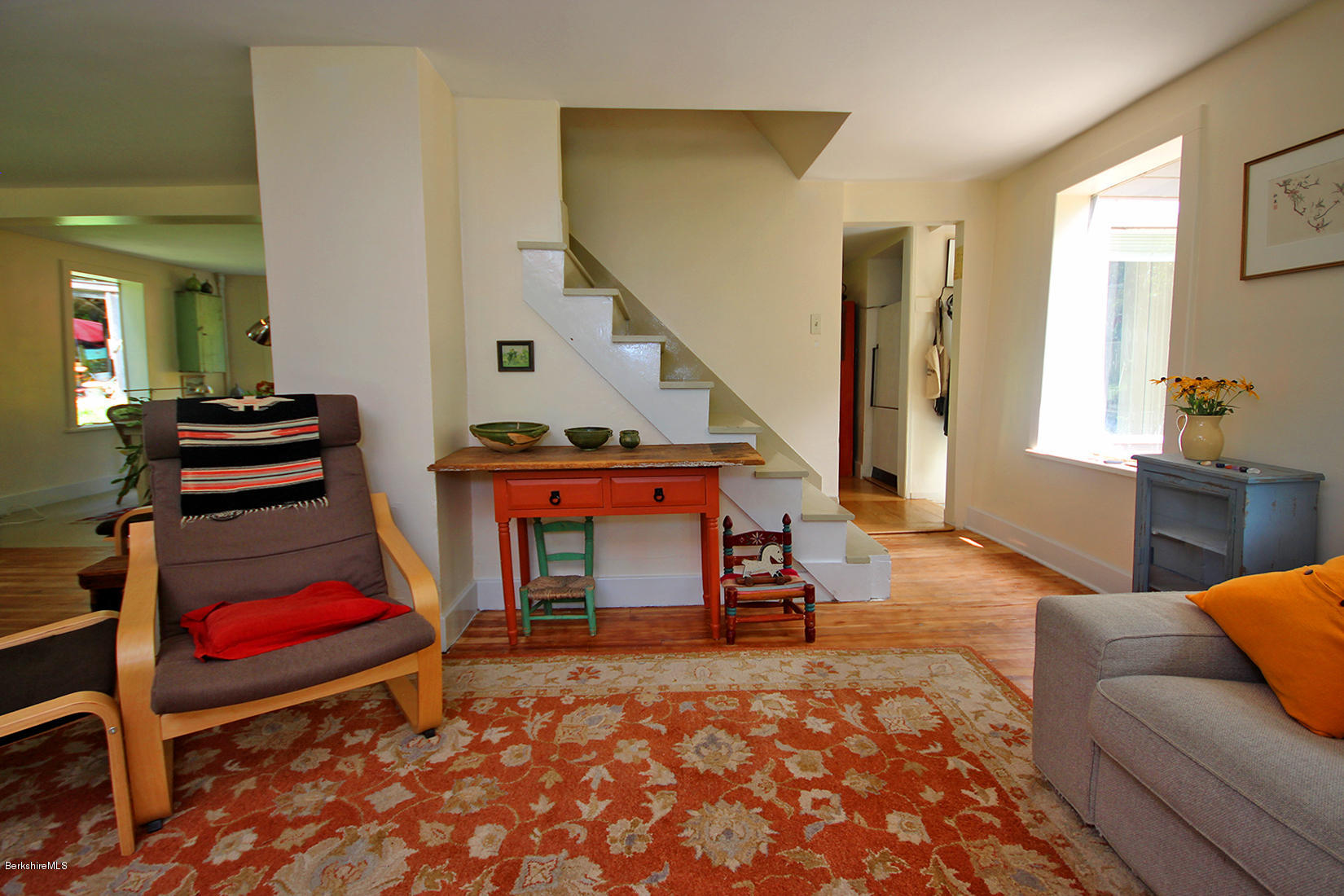 47 Main Road Tyringham, MA 01238 - Photo 8 of 31 a living room with furniture a piano and a fireplace